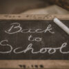 Chalk board with the words Back to School in cursive.